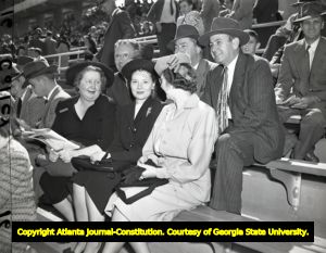 Governor Thompson with wife and friends at a Yellow Jacket football game, 1947