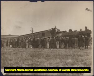 Crowd observing the wreckage of Southern Railway's Royal Palm that had collided head-on with the Ponce de Leon, at Rockmart, Georgia, December 23, 1929. This photograph was probably taken the following day.