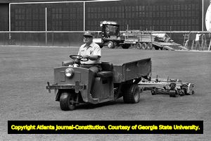 Groundskeeper Robert Johnson maintaining the Atlanta Braves baseball field, 1982