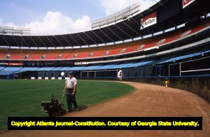 Groundskeeper Robert Johnson maintaining the Atlanta Braves baseball field, 1982