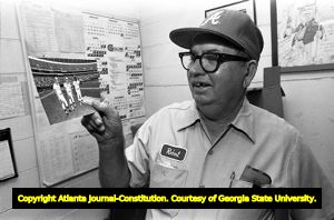 Groundskeeper Robert Johnson maintaining the Atlanta Braves baseball field, 1982