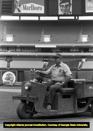 Groundskeeper Robert Johnson maintaining the Atlanta Braves baseball field, 1982