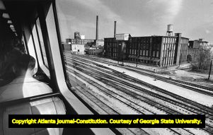 View of the Fulton Bag and Cotton Mill seen from the window of a passing MARTA train, 1980s