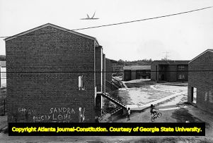 Children playing outside the Maynard Terrace public housing apartments, 1978