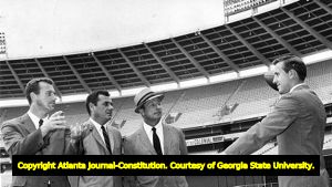 Former Georgia Bulldog players Fran Tarkenton and Jimmy Orr with Rankin Smith and Jim Clay at the Atlanta Fulton County Stadium, 1965