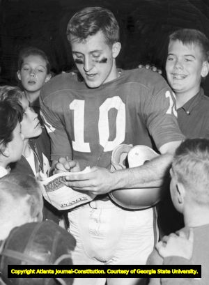 Geogia Bulldog Quarterback Fran Tarkenton signs autographs for fans, 1958