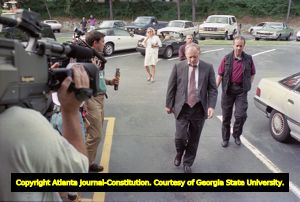 Investigators arriving at Richard Jewell's apartment for questioning in the Centennial Olympic Park bombing, 1996