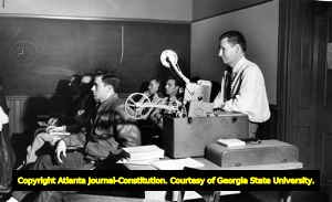 College professor using a projector during Georgia Tech's night class, 1940s