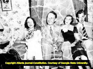Family portrait of Mayor Hartsfield with wife Pearl, daughter Mildred, and son William, 1937