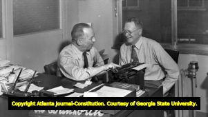 Newspaper editor Ed Danhorth at his desk, 1940s