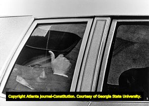 Atlanta Child Murders suspect Wayne Williams giving a thumbs up as he leaves the Fulton County courthouse, 1982