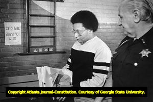 Atlanta Child Murders suspect Wayne Williams being led to a press conference at the Fulton County Jail, 1983