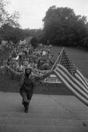 Participants in the Atlanta Pride parade celebrating through downtown, 1977
