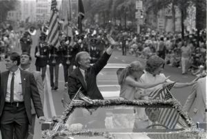 Crowds in downtown Atlanta watching President Jimmy Carter in a Fourth of July parade, 1981