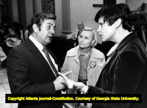 State Legislator Carl Harrison has a debate with Greta Abbott and Claire Watt over the ratification struggle for the Equal Rights Amendment, Atlanta, Georgia, 1981 or 1982.
