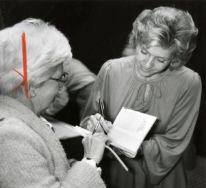 Ruth Carter Stapleton, sister of Jimmy Carter, signing a book for a fan, 1980