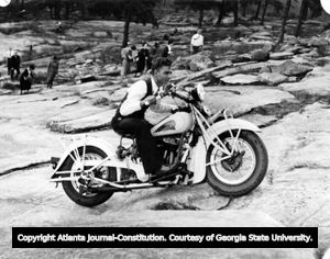 Carl Smith rides his Indian Motorcycle Company bike up Stone Mountain, Georgia, 1935.