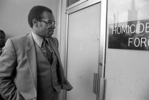 Members entering the Task Force headquarters for a press conference discussing the closing of the force after the conviction of Wayne Williams, 1982