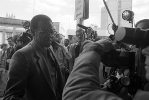 Members entering the Task Force headquarters for a press conference discussing the closing of the force after the conviction of Wayne Williams, 1982