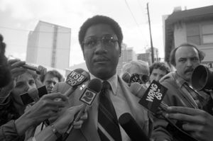 Members entering the Task Force headquarters for a press conference discussing the closing of the force after the conviction of Wayne Williams, 1982