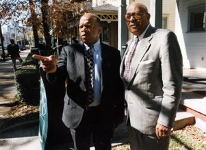 Representative John Lewiswith Roswell O. Sutton discussing the restoration of the King National Historic site, 1994