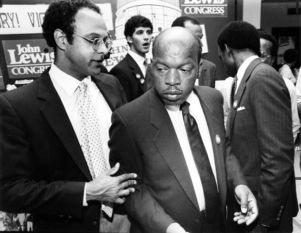 Congressional candidate John Lewis speaking with Councilman Bill Campbell at campaign headquarters, 1986