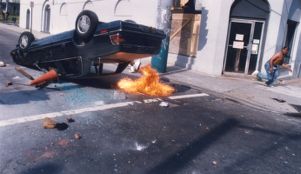 Overturned car set on fire during demonstrations in response to the Rodney King verdict, 1992