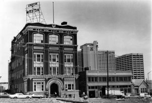 Exterior of the Atlanta Union Mission building on Ellis Street with the Hilton in the background, 1982