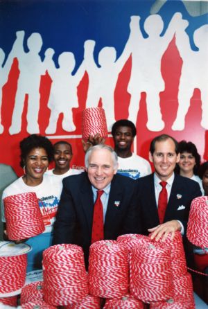 Employees of the Wellington Textile Mill pose with cord manufactured for the Hands Across America event, 1986