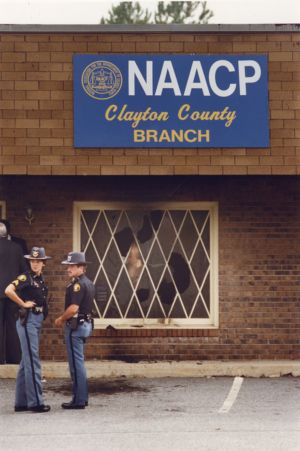 Window damage showing the damage from a bombing at the NAACP Clayton County headquarters, 1990