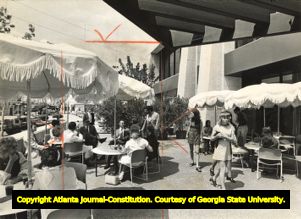 Outdoor diners enjoying the new restaurant Cafe Quatorze at Colony Square, 1971