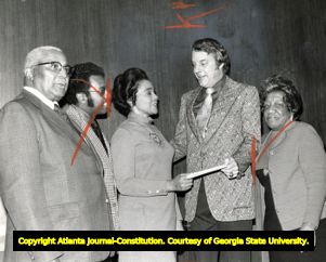 Coretta Scott King, with Martin Luther King Sr. and Alberta Williams King, accepts a check towards the creation of the Martin Luther King Jr. Center, 1973