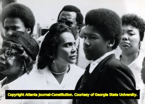 Coretta Scott King with family during the funeral service of Alberta Williams King at Spelman College, 1974