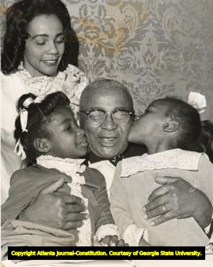 Family moment of Martin Luther King Sr. with Coretta Scott King and children Bernice King and Angela King, 1969