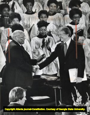 President Jimmy Carter greets Martin Luther King Sr. during an awards ceremony, 1979