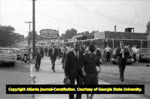 Crowd forms around segregationist Lester Maddox's restaurant The Pickrick to keep African-Americans from entering the eatery, 1964