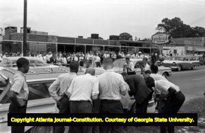 Crowd forms around segregationist Lester Maddox's restaurant The Pickrick to keep African-Americans from entering the eatery, 1964