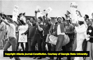 Civil rights activist Hosea Williams leads a demonstration against Police Chief John Inman after a rise in incidents of police brutality, 1974