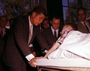 Presidential hopeful Senator John F. Kennedy meets with Michael Stanton, a young boy receiving polio treatments in Warm Springs, 1960