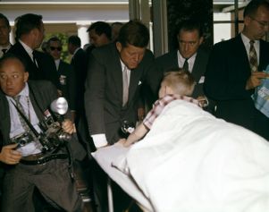 Presidential hopeful Senator John F. Kennedy meets with Michael Stanton, a young boy receiving polio treatments in Warm Springs, 1960