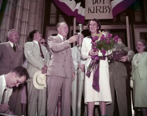 Atlanta mayor Hartsfield welcomes Dorothy Kirby after winning the golf tournament, 1951