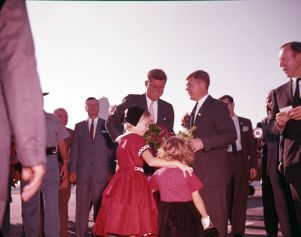 Senator John F. Kennedy being presented flowers after arriving in Georgia, 1960
