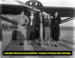 Aviatrix Amelia Earhart poses with women pilots from the Ninety-Nines at Candler Field Airport, 1934