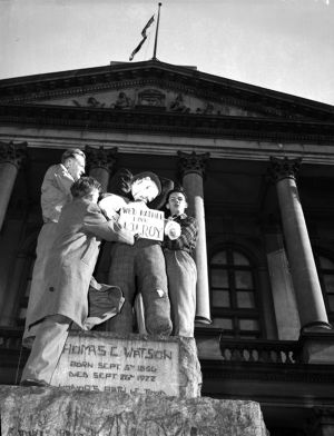 Student protestors posting effigy labeled "We'd rather have Kilroy," on statue outside Georgia State Capitol building, during the "Three Governors Controversy," Atlanta, Georgia, 1947. Negative labeled with faint inscription that may read: "Talmadge dummy in effigy" [?]
