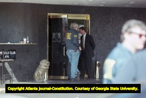 FBI and IRS agents execute a search warrant on The Gold Club for tax fraud and other charges, 1999