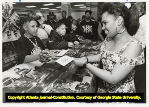 Fans receive autographs from the hip hop group Kris Kross, 1992