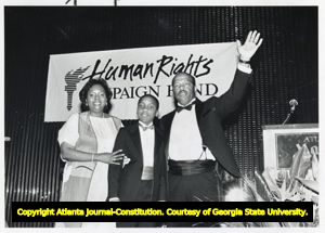 Representative John Lewis with wife Lillian Lewis and son John Miles during a fundraiser for the Human Rights Campaign Fund, 1988