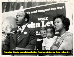 John Lewis conceeding during his 1977 Atlanta open primary, on stage with wife Lillian Lewis and son John Miles Lewis, 1977