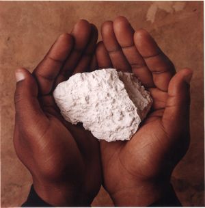 Hands holding kaolin clay, Georgia, April 22, 1993.