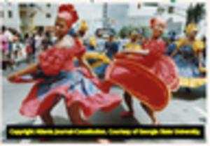 Paulette Cousin's Jamaica Dance Theatre company perform during the National Black Arts Festival parade on Peachtree Street, 1990